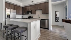 Fridge, dining tables - Landing | Spectacular 2BD, Yoga Studio (Fort Myers)