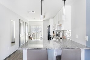 Fridge, dining tables - Landing | Chic 3BD, Game Room, Rooftop Lounge (Bellview)