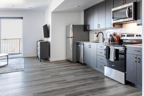 Fridge, dining tables - Landing | Modern 1BD in Central City (Salt Lake City)