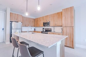 Fridge, dining tables - Landing | Modern 1BD, Pool, Gym (Palm Bay)