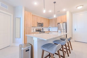 Fridge, dining tables - Landing | Stylish 2BD, Pool, Gym (Palm Bay)