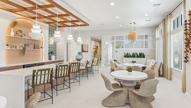 A modern interior with a kitchen, dining area, and seating space. - Landing | Chic 2BD, Pool, Clubhouse (Palm Bay)