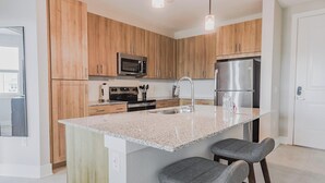 Fridge, dining tables - Landing | Chic 2BD, Pool, Clubhouse (Palm Bay)