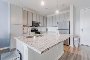 Fridge, dining tables - Landing | Chic 1BD, Clubhouse, Game Room (Palm Bay)