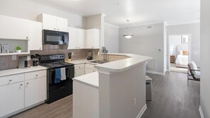 Fridge, dining tables - Landing | Incredible 2BD, Pool, Gym (San Antonio)