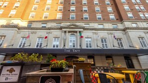A hotel facade with a sign reading 'THE TAFT' and multiple flags. - Landing | Beautiful 1BD, Gym (New Haven)