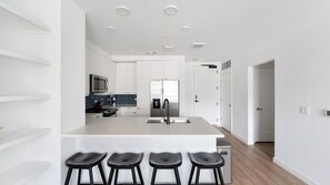 Fridge, dining tables - Landing | Chic 2BD, Pool, Gym (Nashville)