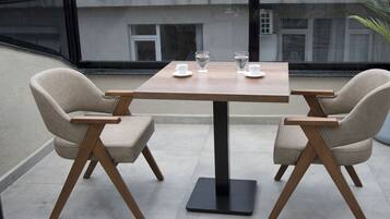 Deluxe Triple Room, Balcony, City View | Terrace/patio