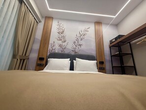 Chambre Triple Deluxe | Literie hypoallergénique, minibar, coffres-forts dans les chambres