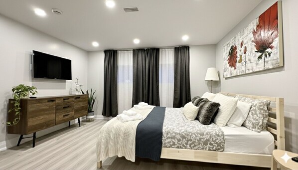 1 bedroom, desk, iron/ironing board, travel crib