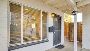 A house with a large window, a dark door, and a mailbox. - 4 Mi to Dtwn PHX: Midtown Condo w/ Patio! (Phoenix)