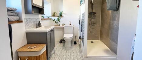 Shower, hair dryer, towels, soap