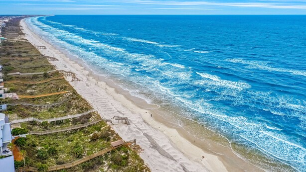 A coastal view with a beach, ocean, and a boardwalk. - Condo Across the Street From the Beach With Pool, Tennis, &. Washer/dryer (St. Augustine)