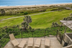 A deck with lounge chairs overlooking a golf course and beach. - Charming Amelia Island Plantation Condo With Balcony, AC, Washer/dryer & Pool (Fernandina Beach)