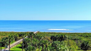 A coastal view with a wooden walkway leading to a beach. - Blue Horizon at Surf Club - Ocean Views 3rd Floor Corner Wraparound Balcony! (Palm Coast)