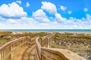 A wooden boardwalk leading to a beach with dunes and a clear sky. - Dog-friendly Beachwood Home in Omni Plantation With Pool & Beach Access (Fernandina Beach)