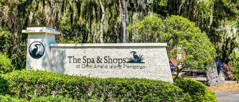 A sign for The Spa & Shops at Ocean Amelia Island Plantation.