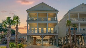 A two-story beachfront hotel with balconies and a covered walkway. - Almost Heaven on Sunset-Pool-Walk to Beach (Murrells Inlet)