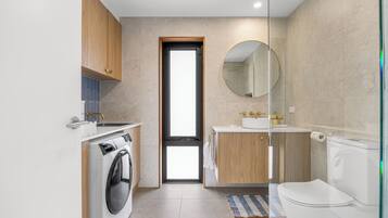 Shower, hair dryer, towels, soap
