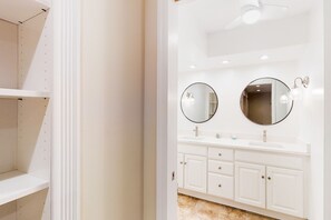 A bathroom with two round mirrors, white cabinets, and a white countertop. - Dog-friendly Home With Central AC, Washer/dryer & Spacious Backyard - Near Beach (St. Simons Island)