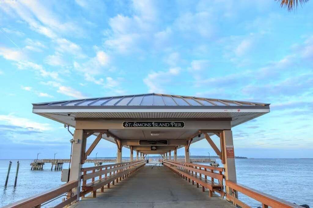 A pier with a covered walkway labeled "St. Simons Island Pier."