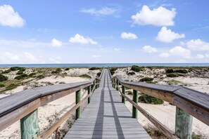 A wooden boardwalk leading to the beach. - Lovely Oceanfront Townhome W/free Wifi, Central AC, Shared Pool, Private W/D (Fernandina Beach)
