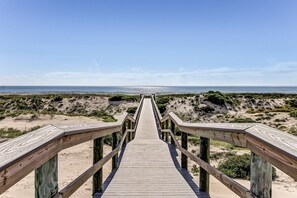 A wooden boardwalk leading to a beach with sandy dunes and a clear sky. - Lovely Oceanfront Townhouse in Summer Beach Village W/shared Pool, Central AC (Fernandina Beach)