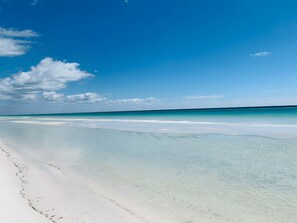 A beach with clear turquoise water and white sand. - Gorgeous Gulf Views - Short Walk to the Beach (Miramar Beach)