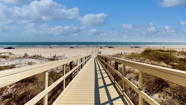 A wooden boardwalk leading to a beach with a clear sky. - Renovated, Ground-floor Condo at Oceanfront Complex With Pool - Steps to Beach (St. Augustine)