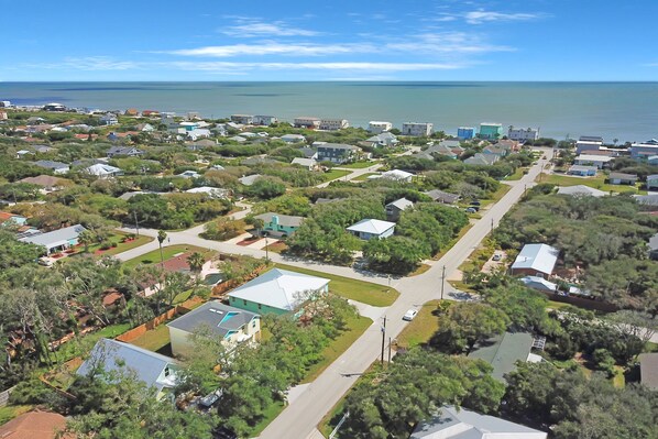 An aerial view of a residential area with houses, roads, and a body of water in the background. - Spacious Beach Home - Just a Block From the Ocean & the River (St. Augustine)