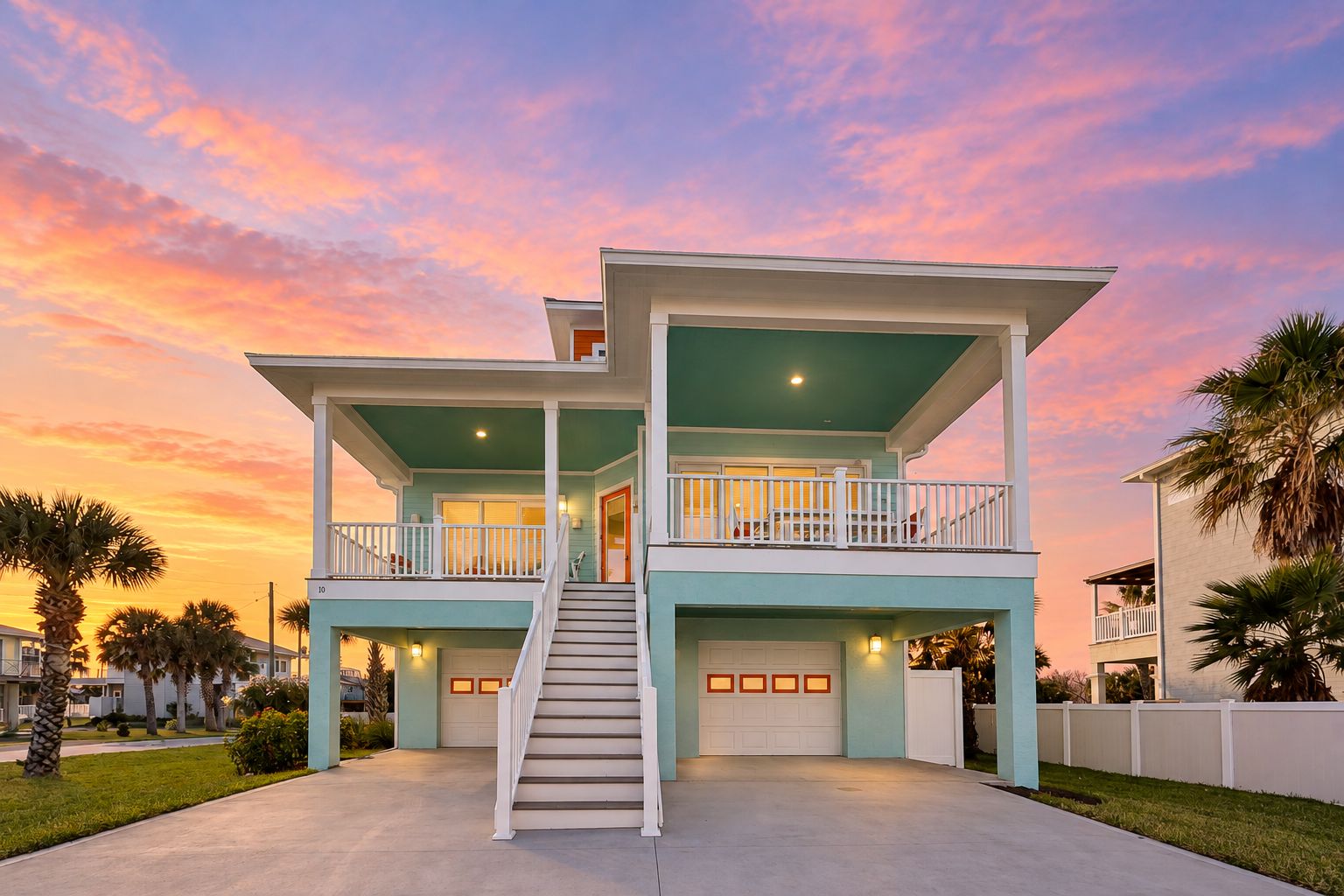 A two-story house with a balcony, a staircase, and a garage.