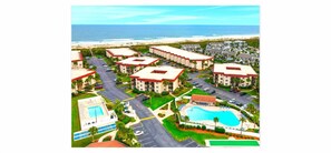 A resort with multiple buildings, a swimming pool, and a beach view. - St Augustine Beach Retreat~ Oceanfront Resort 2 Pools Hot Tubs Pickleball, Trolley! (St. Augustine)