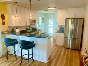 House, Multiple Beds, Patio, Pool View (Surfside Oasis) | Private kitchen | Dining tables - Surfside Oasis ~tropical Pool! Walk to the Beach! (St. Augustine)