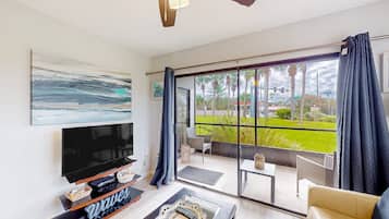 Appartement, 1 queensize bed met slaapbank, terras, uitzicht op tuin (The Shimmering Palm) | Woonruimte