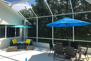 House, Multiple Beds, Pool Access, Pool View (The Barefoot Bungalow) | View from room - The Barefoot Bungalow House in Palm Coast With an Enclosed Pool & Grill (Palm Coast)