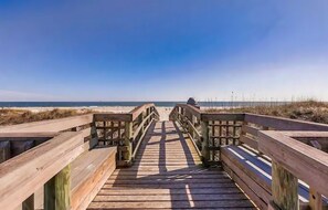 A wooden boardwalk leading to the beach with a clear view of the ocean. - Waterfront Condo With Community Pools & hot tub - Walk to the Beach (St. Augustine)