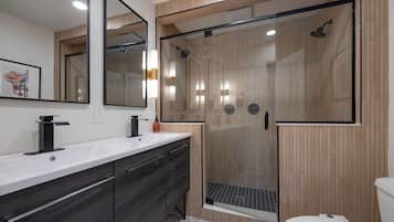 Shower, hair dryer, towels, shampoo