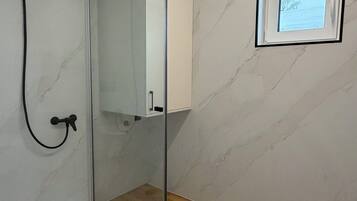 Shower, towels, soap, toilet paper