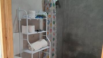 Shower, towels, soap, toilet paper