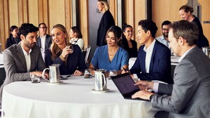 A conference room with round tables, laptops, and water pitchers. - Hyatt House Ontario Airport (Ontario)