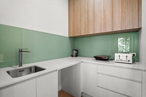 Fridge, microwave, toaster, dining tables