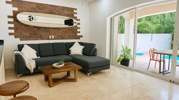 Deluxe Villa, Multiple Bedrooms, Balcony, Pool View | Living area | 65-inch LED TV with digital channels, Netflix, streaming services