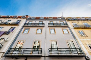 A multi-story building with balconies, windows, and a satellite dish. - Olarias Terrace Lisbon IV (Lisbon)
