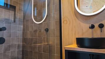 Shower, towels, soap, toilet paper