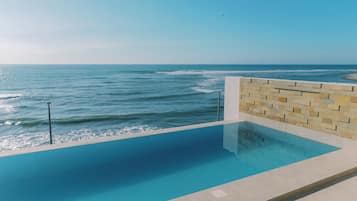 Outdoor pool, open 8:00 AM to 10:00 PM, sun loungers