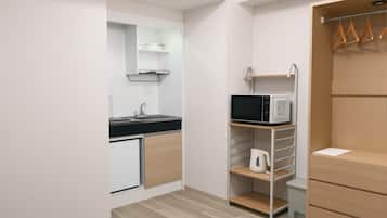 Mini-fridge, microwave, stovetop, cookware/dishes/utensils