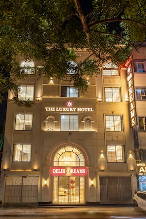 The Luxury Hotel with a prominent entrance and signage. - The Delhi Dreams - A Luxury Hotel (New Delhi)