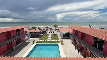 Outdoor pool, pool umbrellas, sun loungers