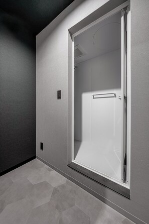 A modern bathroom with a shower, a towel rack, and a vent on the ceiling. - ASTAGE VILLA KAMIFURANO (Kamifurano)