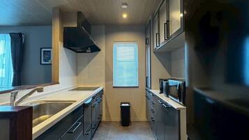 Apartment | Private kitchen | Fridge, microwave, stovetop, cookware/dishes/utensils